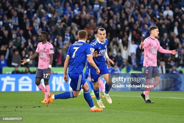 Caglar Soyuncu of Leicester City celebrates with teammate Harvey Barnes after scoring the team's first goal during the Premier League match between...