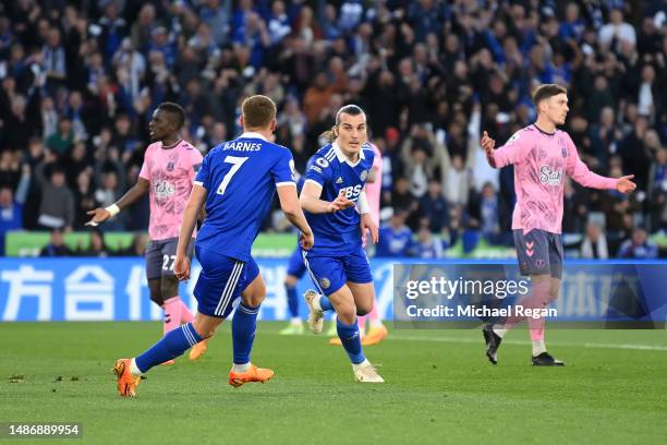 Caglar Soyuncu of Leicester City celebrates with teammate Harvey Barnes after scoring the team's first goal during the Premier League match between...