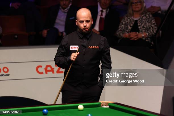 Luca Brecel of Belgium reacts during their Final match against Mark Selby of England on Day Sixteen of the Cazoo World Snooker Championship 2023 at...