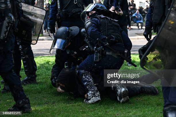 Police clash with protesters during Labor and Solidarity Day on May 1, 2023 in Paris, France. This year's May Day protests coincide with weeks of...