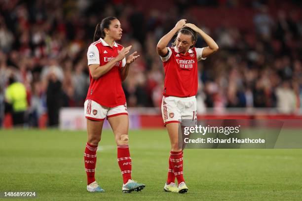 Rafaelle Souza of Arsenal applauds the fans with teammate Katie McCabe after their side's defeat to VfL Wolfsburg during the UEFA Women's Champions...