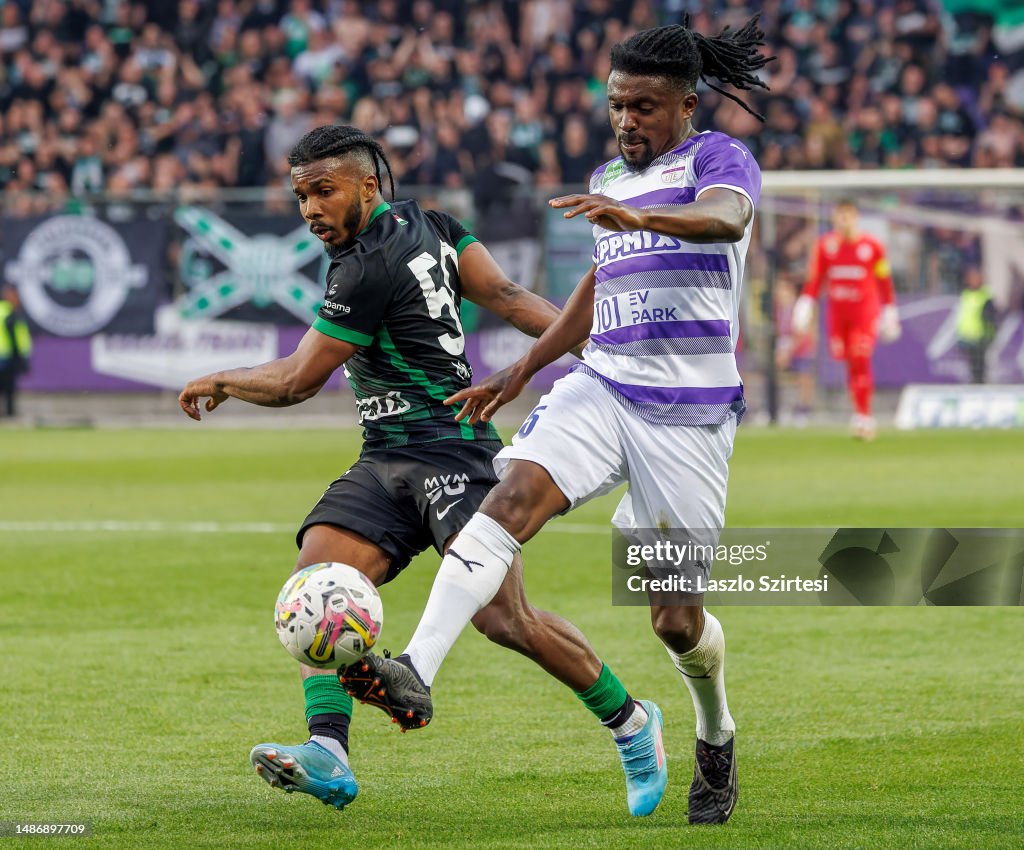 Petrus Boumal of Ujpest FC competes for the ball with Jose Marcos