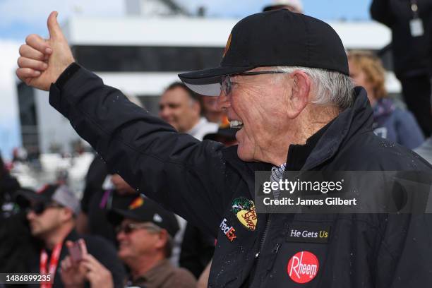 Team owner and Hall of Famer, Joe Gibbs gives a thumbs up to Martin Truex Jr., driver of the Bass Pro Shops Toyota, in victory lane after winning the...