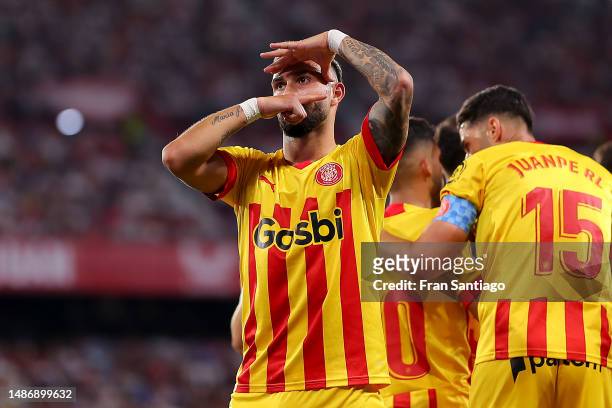 Valentin Castellanos of Girona FC celebrates with teammates after scoring the team's second goal during the LaLiga Santander match between Sevilla FC...