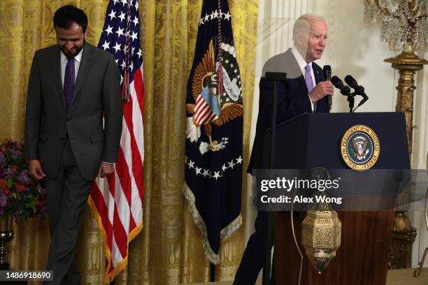 President Joe Biden speaks as Founder and Executive Director of MakeSpace Imam Makhdoom Zia listens during a reception celebrating Eid-al-Fitr in the...