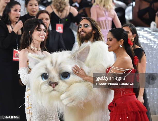 Anne Hathaway, Jared Leto, dressed as Karl Lagerfeld's cat Choupette, and Salma Hayek attend The 2023 Met Gala Celebrating "Karl Lagerfeld: A Line Of...
