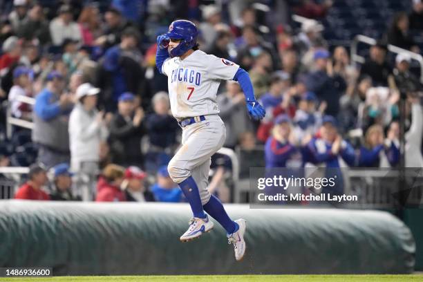 Dansby Swanson of the Chicago Cubs celebrates a two run home run in the fifth inning during a baseball game against the Washington Nationals at...