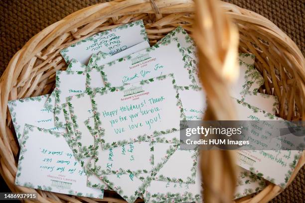 Thank you cards for servicemen and women are collected during a holiday tour in the East Wing Entrance of the White House, Dec. 8, 2010.