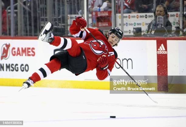 Jack Hughes of the New Jersey Devils slips during the first period against the New York Rangers in Game Seven of the First Round of the 2023 Stanley...