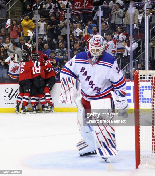 The New Jersey Devils celebrate a second-period goal by Michael McLeod against Igor Shesterkin of the New York Rangers in Game Seven of the First...