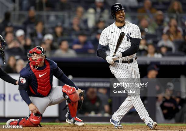 Aaron Hicks of the New York Yankees reacts after he struck out to end the game as Mike Zunino of the Cleveland Guardians defends in the ninth inning...