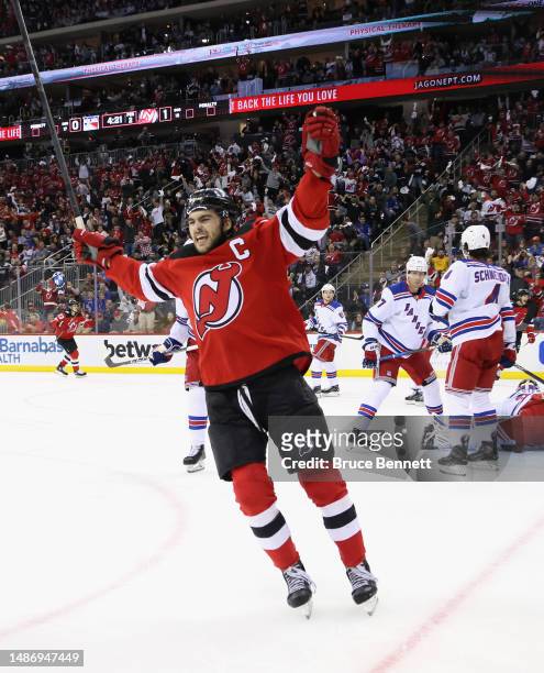 Nico Hischier of the New Jersey Devils celebrates a second-period goal by Tomas Tatar against Igor Shesterkin of the New York Rangers in Game Seven...