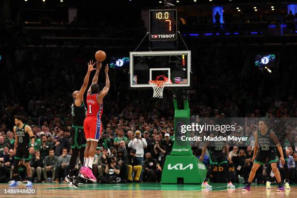 James Harden of the Philadelphia 76ers hits the game winning three point shot past Al Horford of the Boston Celtics during the fourth quarter for the...