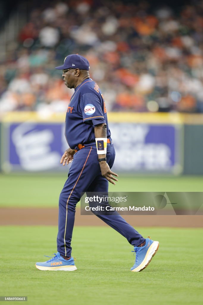 Dustin Baker Dusty Baker Jr. #12 of the Houston Astros walks out to the mound ...