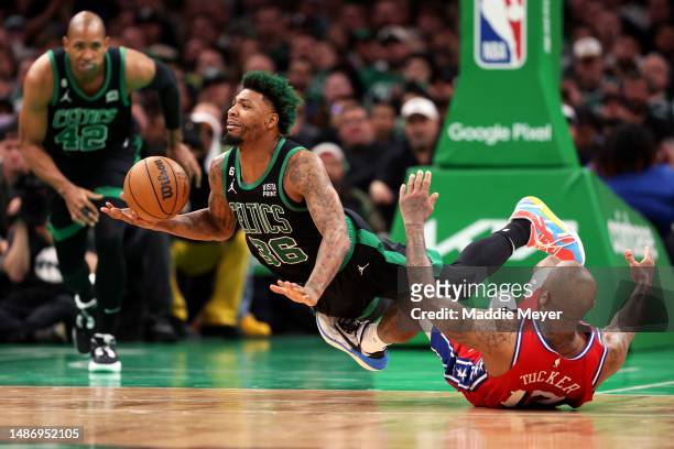 Marcus Smart of the Boston Celtics dives after the ball after being fouled by P.J. Tucker of the Philadelphia 76ers during the second half in game...