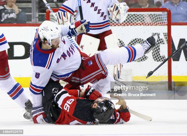 Jacob Trouba of the New York Rangers hits Timo Meier of the New Jersey Devils during the third period in Game Seven of the First Round of the 2023...