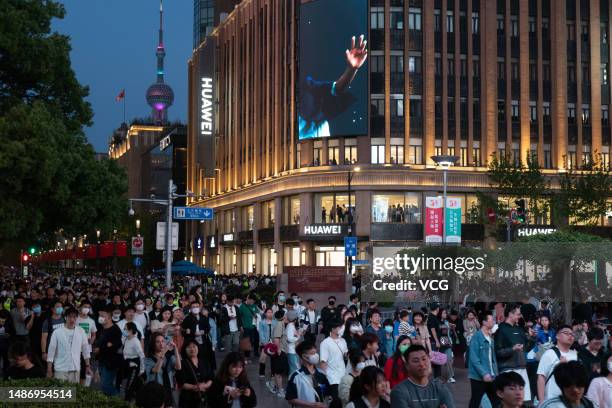 Tourists visit Nanjing Road pedestrian street during the May Day holiday on May 1, 2023 in Shanghai, China.