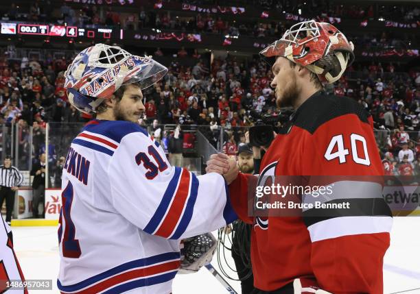 Igor Shesterkin of the New York Rangers congratulates Akira Schmid of the New Jersey Devils after the Devils' 4-0 victory in Game Seven of the First...