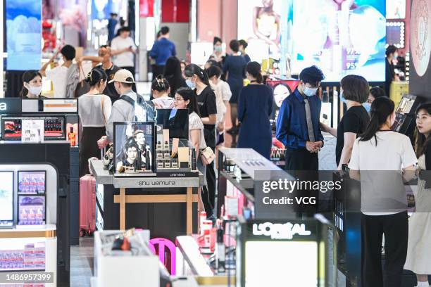 Customers shop at Global Duty-Free Plaza during the May Day holiday on May 1, 2023 in Haikou, Hainan Province of China.