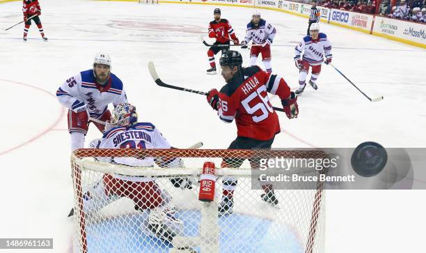 The New York Rangers defend against the New Jersey Devils in Game Seven of the First Round of the 2023 Stanley Cup Playoffs at Prudential Center on...