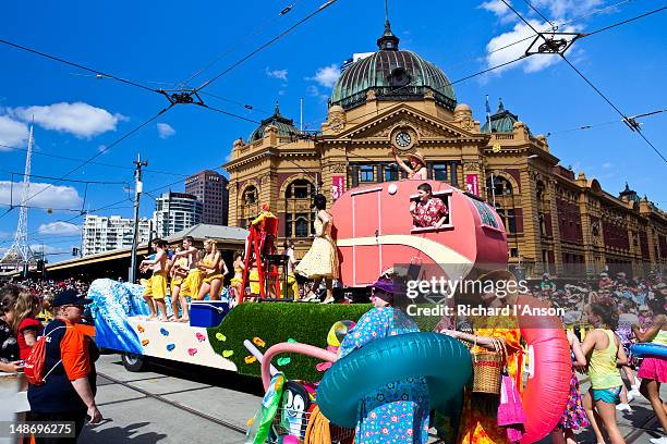 float in moomba festival parade passing flinders street station. - moomba festival parade stock pictures, royalty-free photos & images