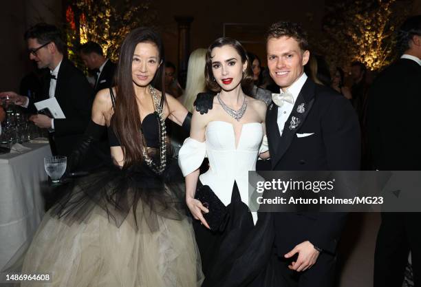 Vera Wang, Lily Collins and Mark Guiducci attend The 2023 Met Gala Celebrating "Karl Lagerfeld: A Line Of Beauty" at The Metropolitan Museum of Art...