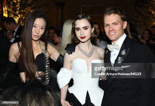 Vera Wang, Lily Collins and Mark Guiducci attend The 2023 Met Gala Celebrating "Karl Lagerfeld: A Line Of Beauty" at The Metropolitan Museum of Art...