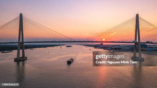 aerial view of my thuan cable-stayed bridge in the sunset, tien giang province - river mekong stock pictures, royalty-free photos & images