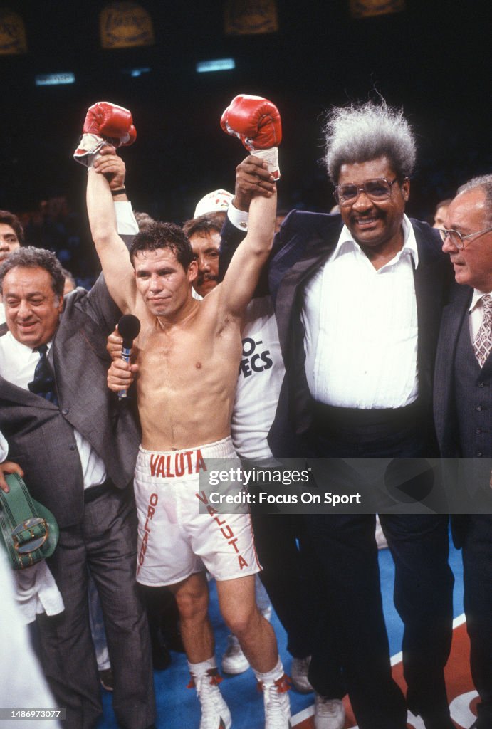 Boxing Rce King Boxing promoters Don King and Bob Arum raises the arms of Boxer Julio ...