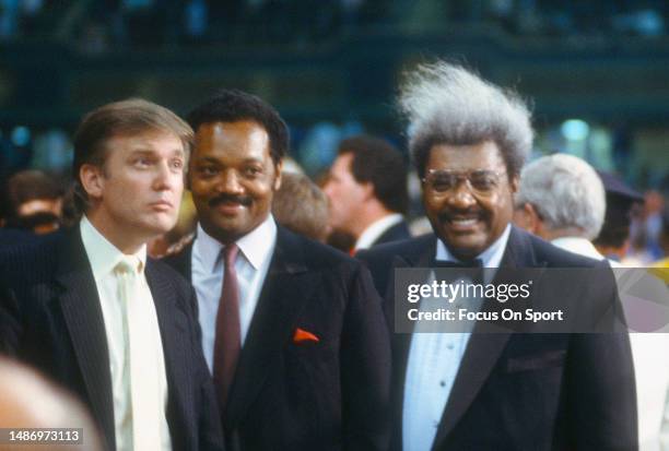 Boxing promoter Don King reverend Jesse Jackson and Donald Trump together during a boxing match circa 1988.