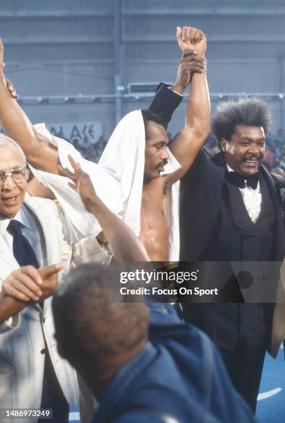 Boxing promoter Don King hold up the arm of heavyweight boxer Ken Norton Sr. After Norton won a boxing match circa 1977 at Caesars Palace in Las...