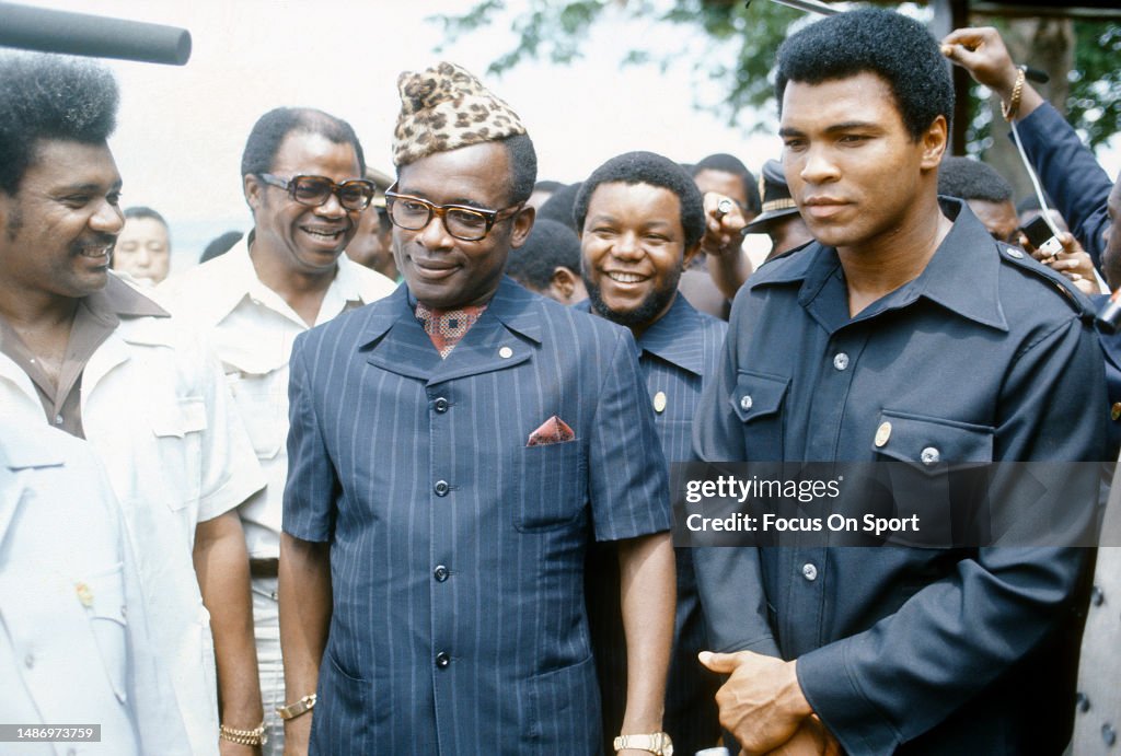 Ali R L Heavyweight boxer Muhammad Ali Mobutu Sees Seko and Don King walking ...