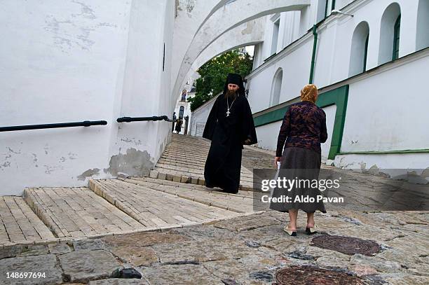 priest by pechersk lavra, or monastery of the caves. - kiev caves monastery stock pictures, royalty-free photos & images
