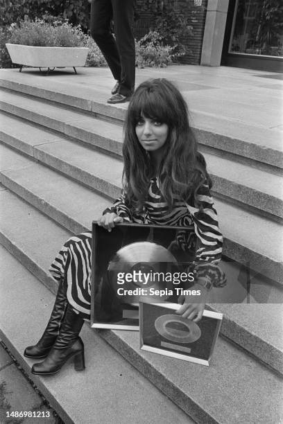 Shocking Blue receives gold and platinum records at Hilton Hotel, Amsterdam; Mariska Veres with records, September 2 The Netherlands, 20th century...