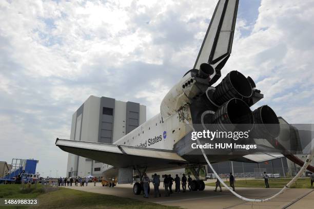 Space shuttle Atlantis is slowly towed from the Shuttle Landing Facility to an orbiter processing facility at NASA's Kennedy Space Center in Florida...