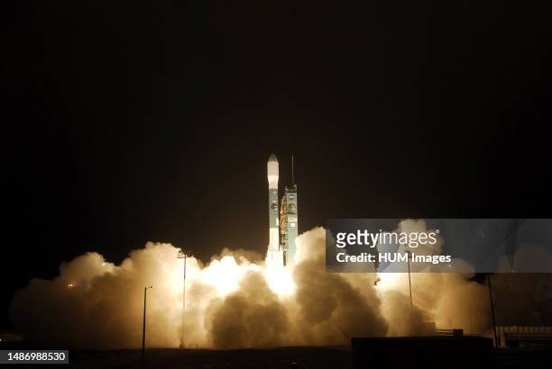 An exhaust cloud builds around the United Launch Alliance Delta II rocket as it lifts off Space Launch Complex 2 at Vandenberg Air Force Base,...