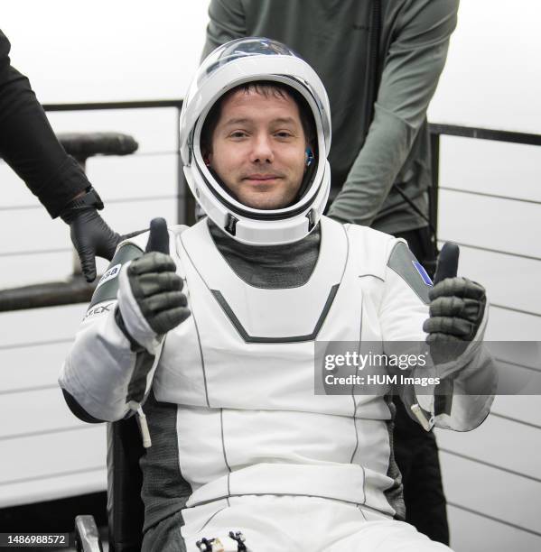 Astronaut Thomas Pesquet gives a thumbs up after being helped out of the SpaceX Crew Dragon Endeavour spacecraft onboard the SpaceX GO Navigator...