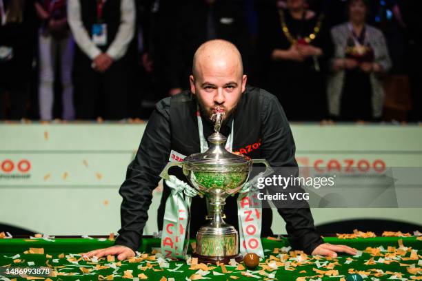 Luca Brecel of Belgium poses with the trophy after winning the final match against Mark Selby of England on day 17 of the 2023 Cazoo World...