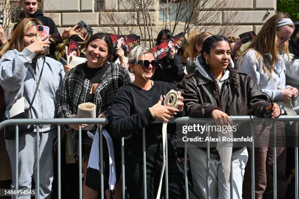 Fans hold pieces of the red carpet after receiving them ahead of The 2023 Met Gala Celebrating "Karl Lagerfeld: A Line Of Beauty" at The Metropolitan...