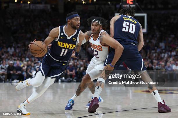 Bruce Brown of the Denver Nuggets drives off a pick by Aaron Gordon against Ish Wainright of the Phoenix Suns in the second quarter during Game Two...