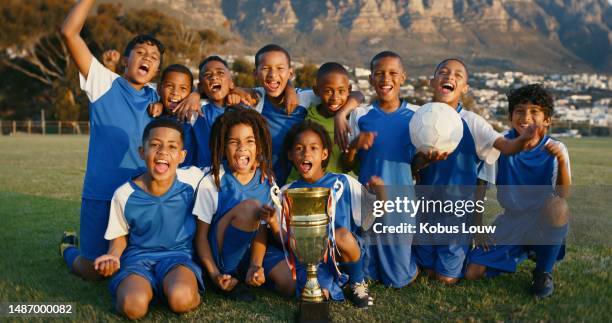 celebration, kids and soccer player team with trophy, happiness and excited with cheers and portrait on field. group of youth, children win at sport and fitness with champion of game and achievement - school sports equipment stock pictures, royalty-free photos & images