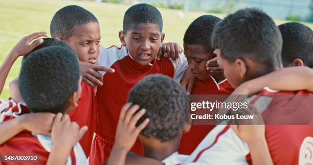 children, football circle and talking of sports teamwork, competition strategy and game on field for training and leadership. biracial kids or boys in soccer team with group discussion of goals - creative pitch stock pictures, royalty-free photos & images