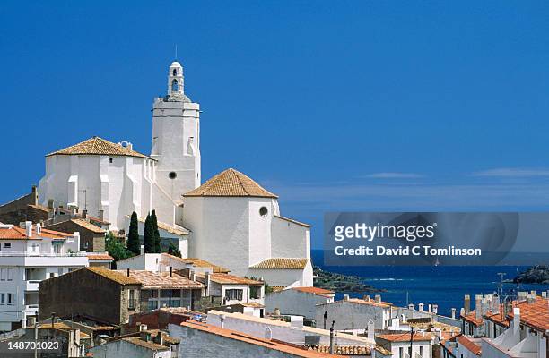 village church on hillside with mediterranean in background. - cadaques stock pictures, royalty-free photos & images