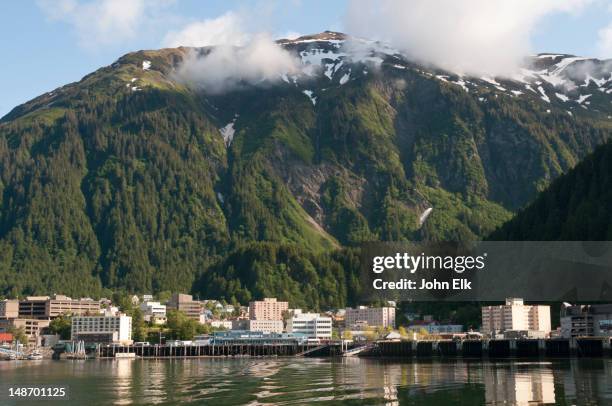 city across water. - alaska stock pictures, royalty-free photos & images