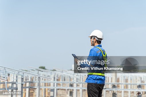 Asian engineer checking progress and structure at construction site. Asian engineer checking progress and structure at construction site.