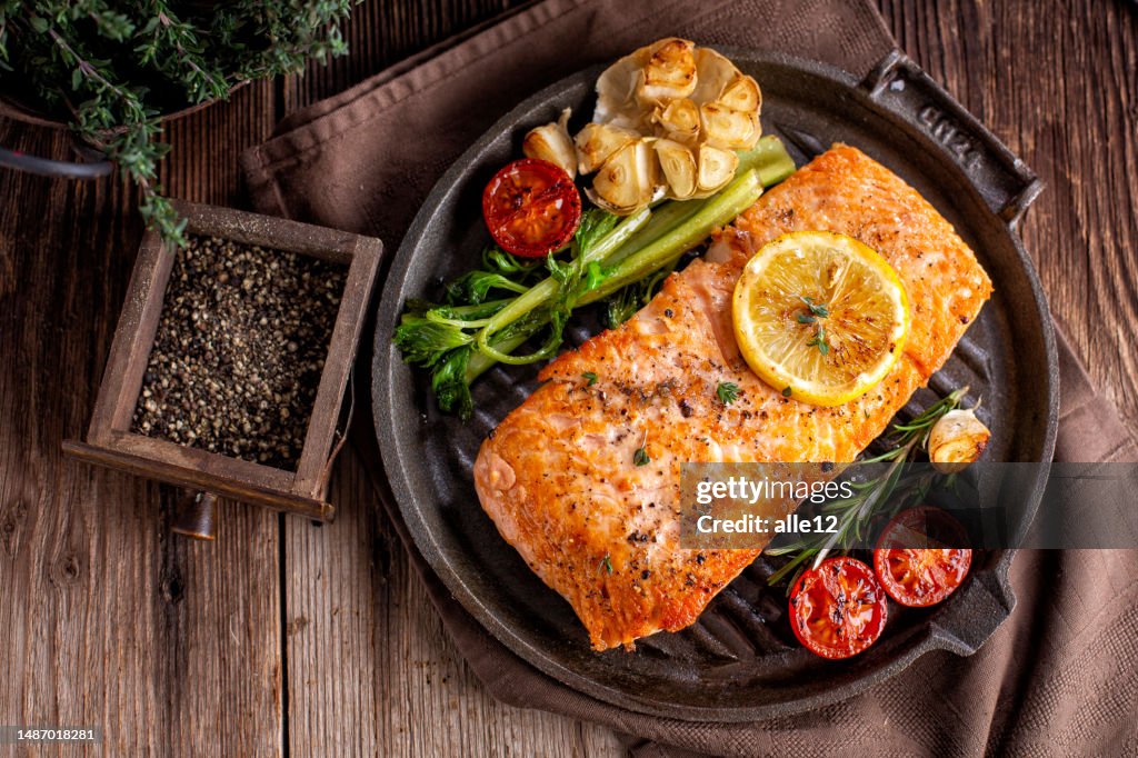 Roasted salmon in iron pan