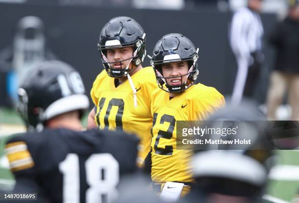 Quaterbacks Cade McNamara and Deacon Hill of the Iowa Hawkeyes during the Iowa Spring Open Practice at Kinnick Stadium on April 22, 2023 in Iowa...