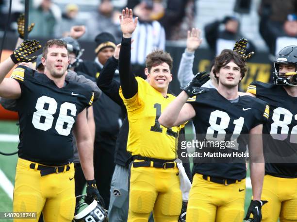 Quarterback Cade McNamara of the Iowa Hawkeyes waves to patients at the Iowa Stead Family Childrens Hospital during a break in the action during the...
