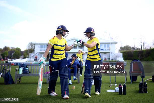 Alice Capsey and Kira Chathli of South East Stars walk out to bat during the Rachael Heyhoe Flint Trophy match between South East Stars and Southern...