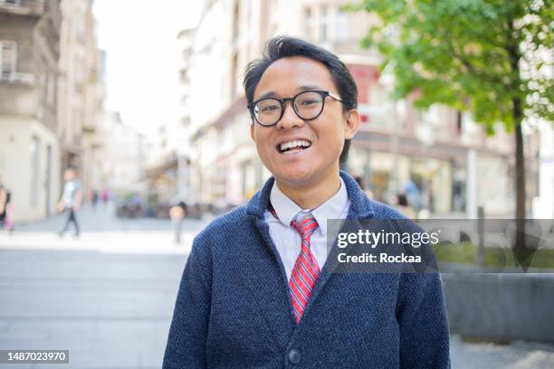 beautiful young man posing outside - indonesian ethnicity stock pictures, royalty-free photos & images